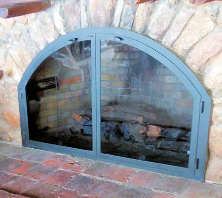 Over Sized Osterville Arch All black finish, twin doors (heavy hinges), standard smoke glass with vice grip handles. Standard smoked glass, no mesh, no glass.  (Mortar install on stone)